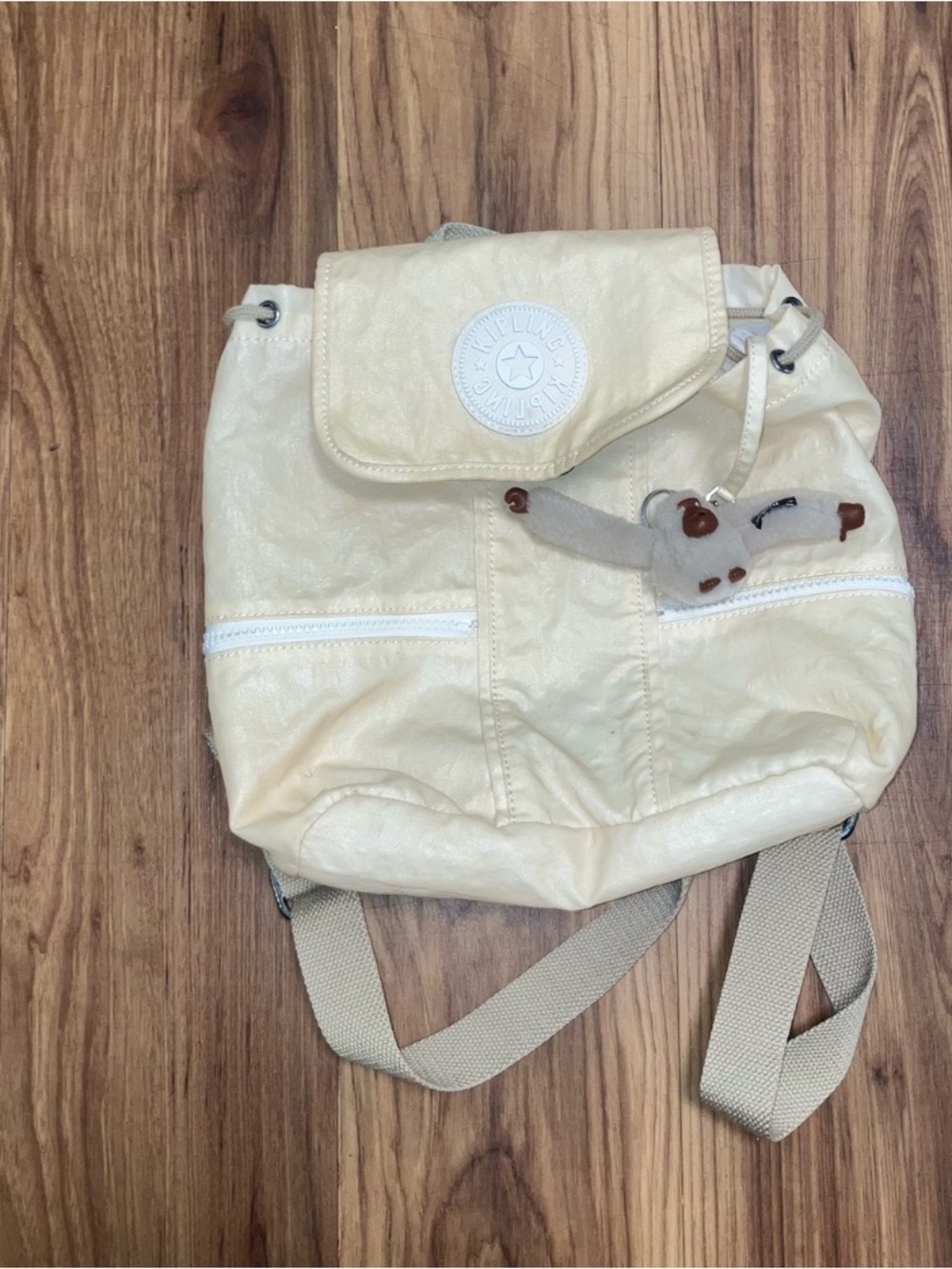 #monkey Kipling Cream Drawstring Flap Backpack with Monkey Charm